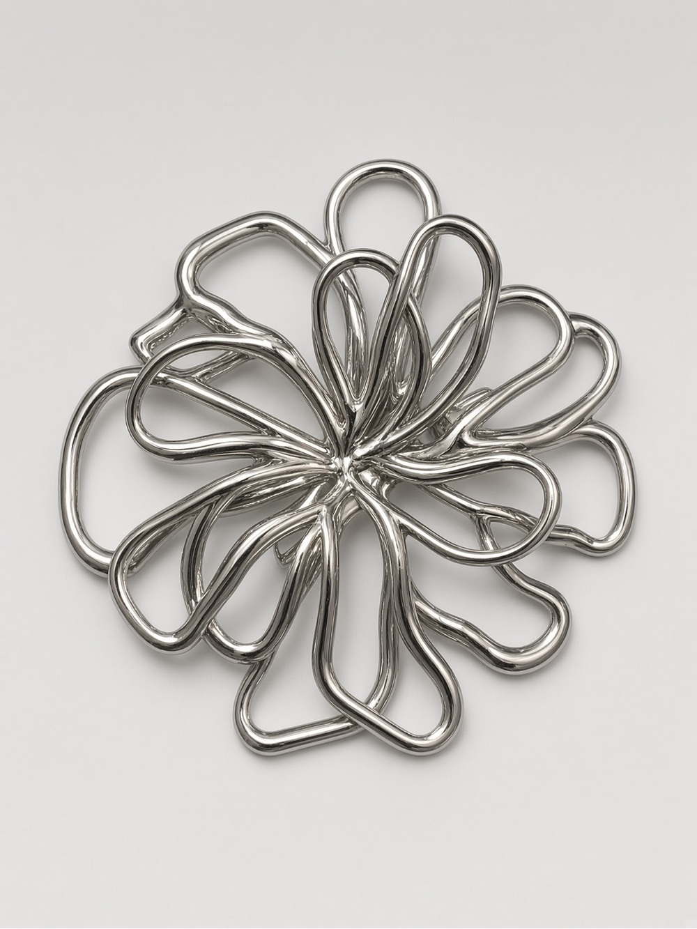 Silver hollow floral brooch